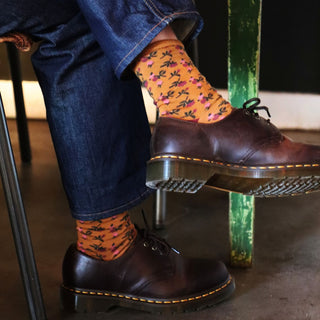 girl wearing floral socks in mustard