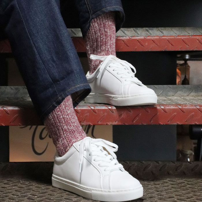 girl wearing red marl cotton socks with trainers